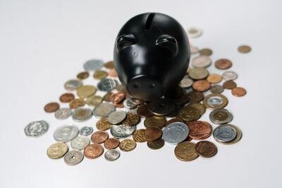 piggybank on a pile of coins